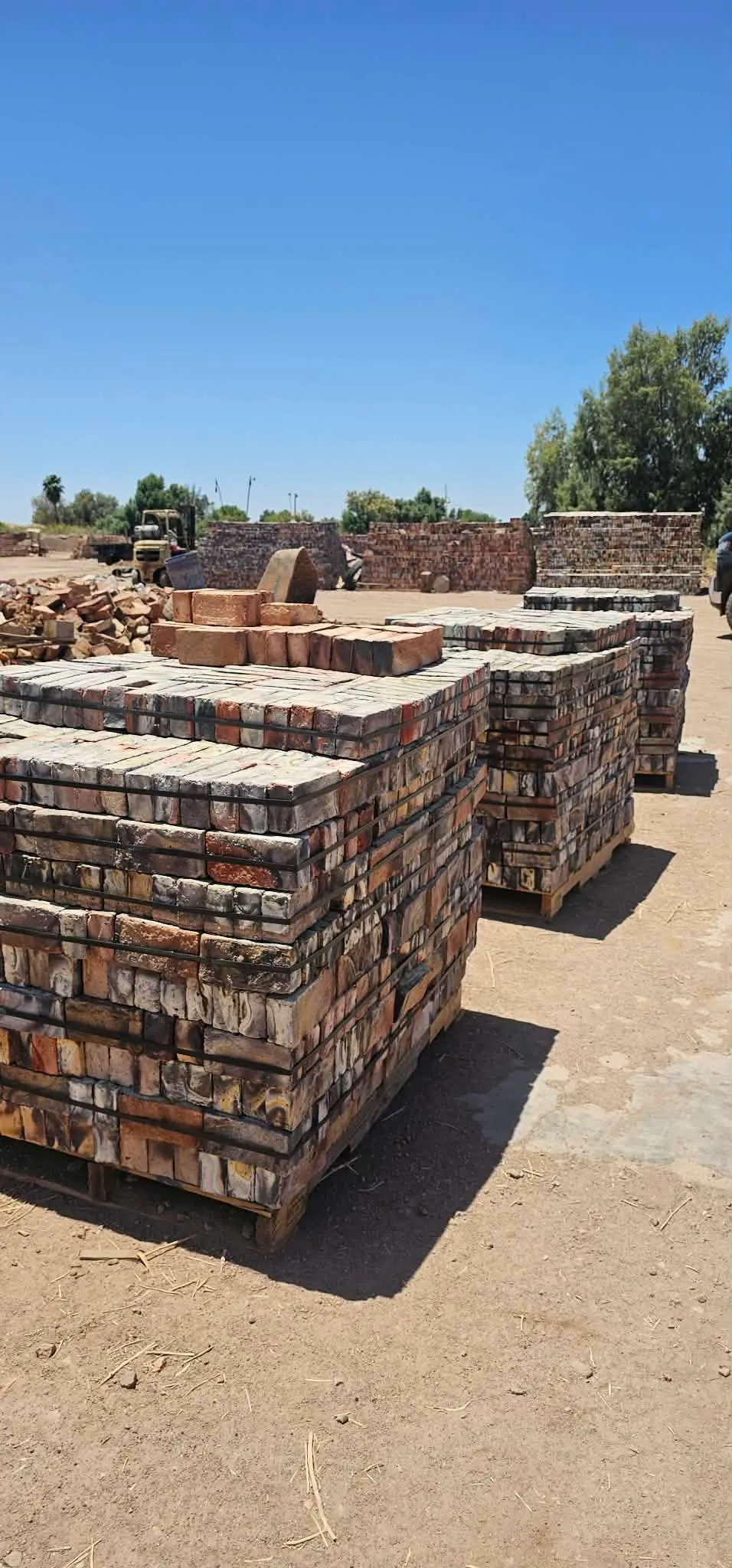 Pallets of handcrafted brick in the material yard
