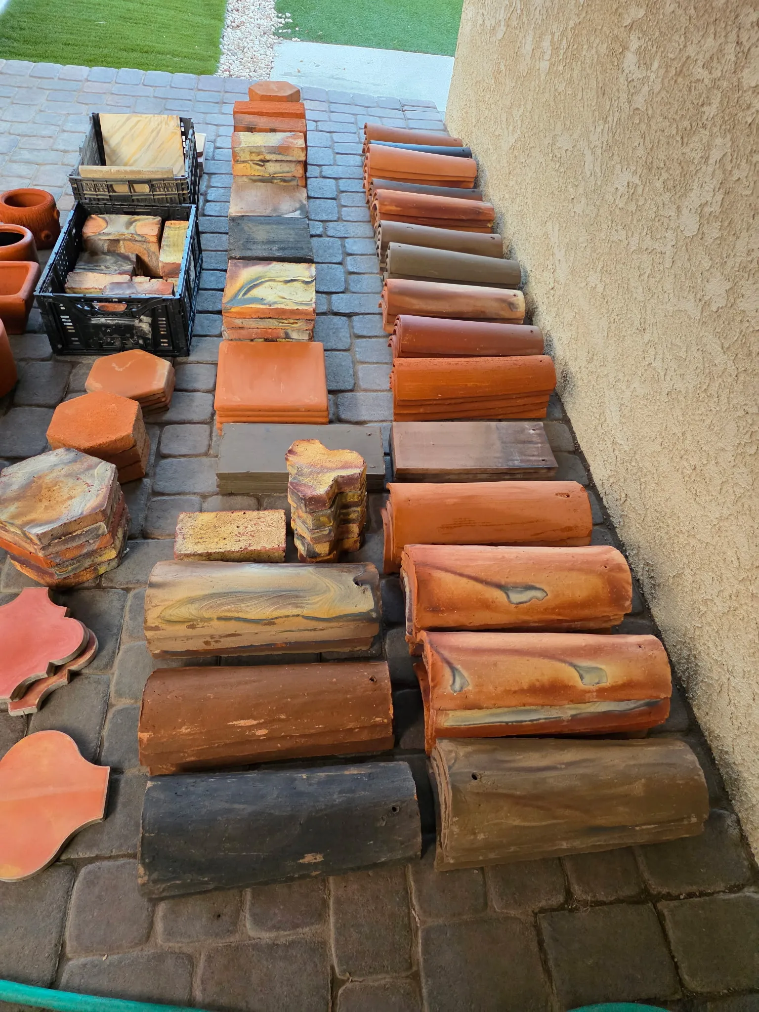 Rows of handcrafted clay building material samples