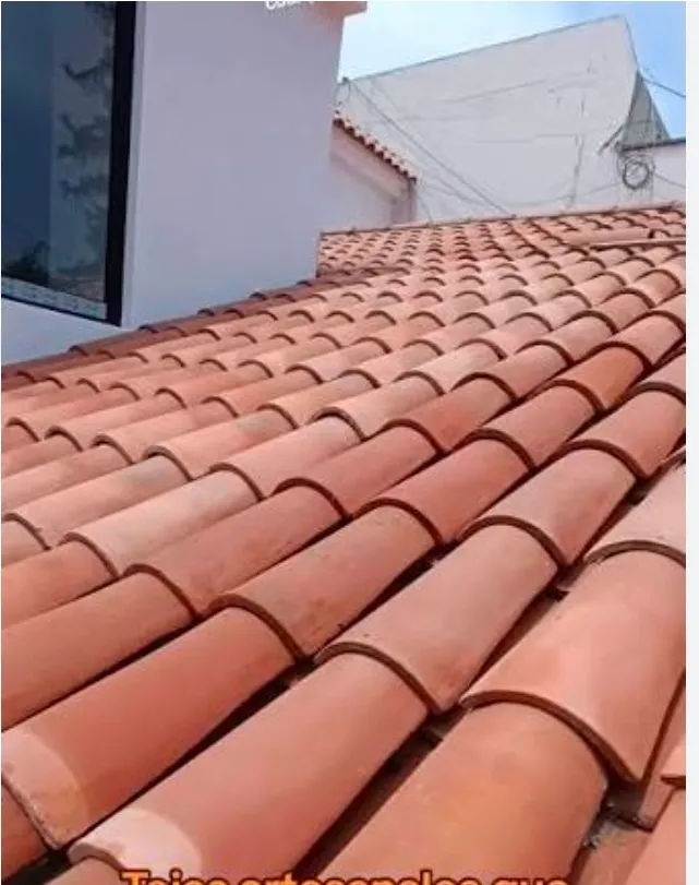 Terracotta barrel tile installed across a sloped roof