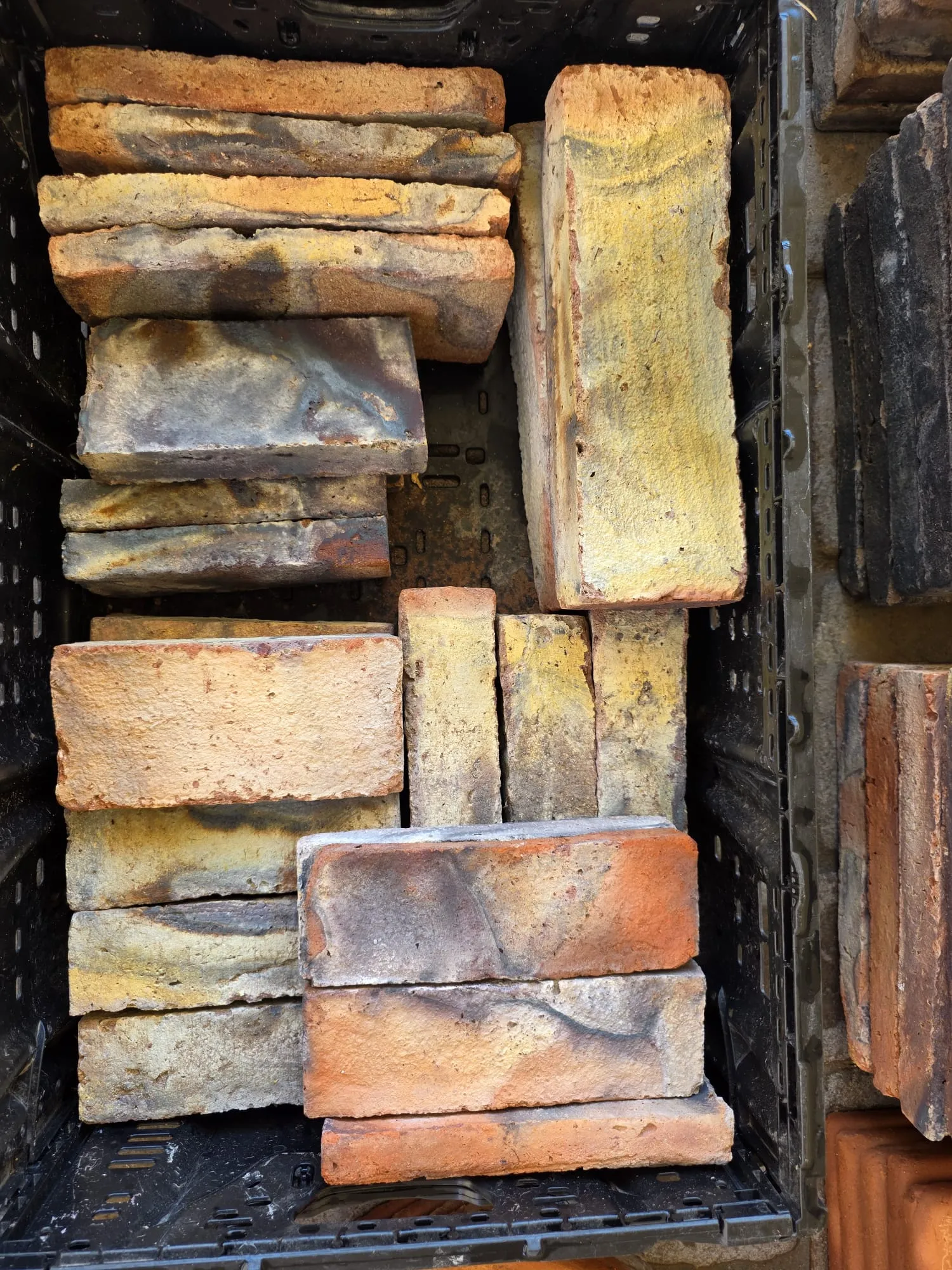 Close-up assortment of multitone handcrafted architectural bricks